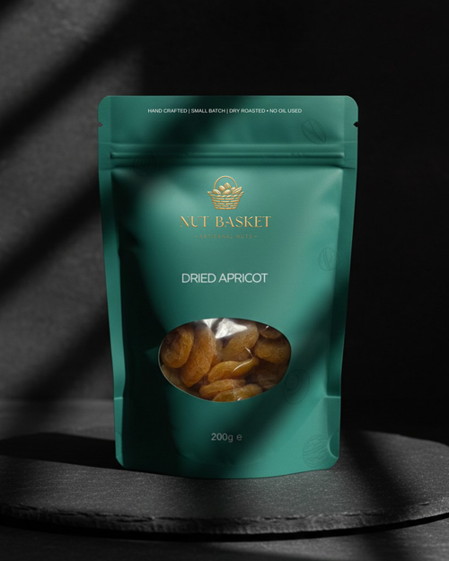Teal package of Nut Basket dried apricots on a dark background