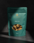 Teal package of Nut Basket dried figs on a dark background