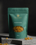 Green package of Nut Basket Golden Raisins on a dark background