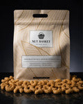 Nut Basket packaging with roasted nuts on a dark background