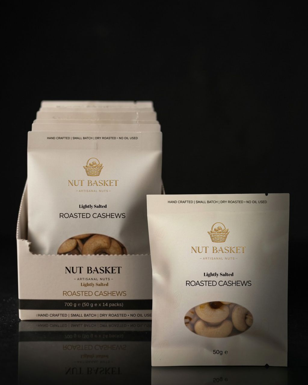 NUT BASKET roasted cashew packages on a black background