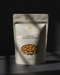 Package of Nut Basket roasted chickpeas on a dark background