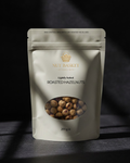 Package of Nut Basket roasted hazelnuts on a dark background