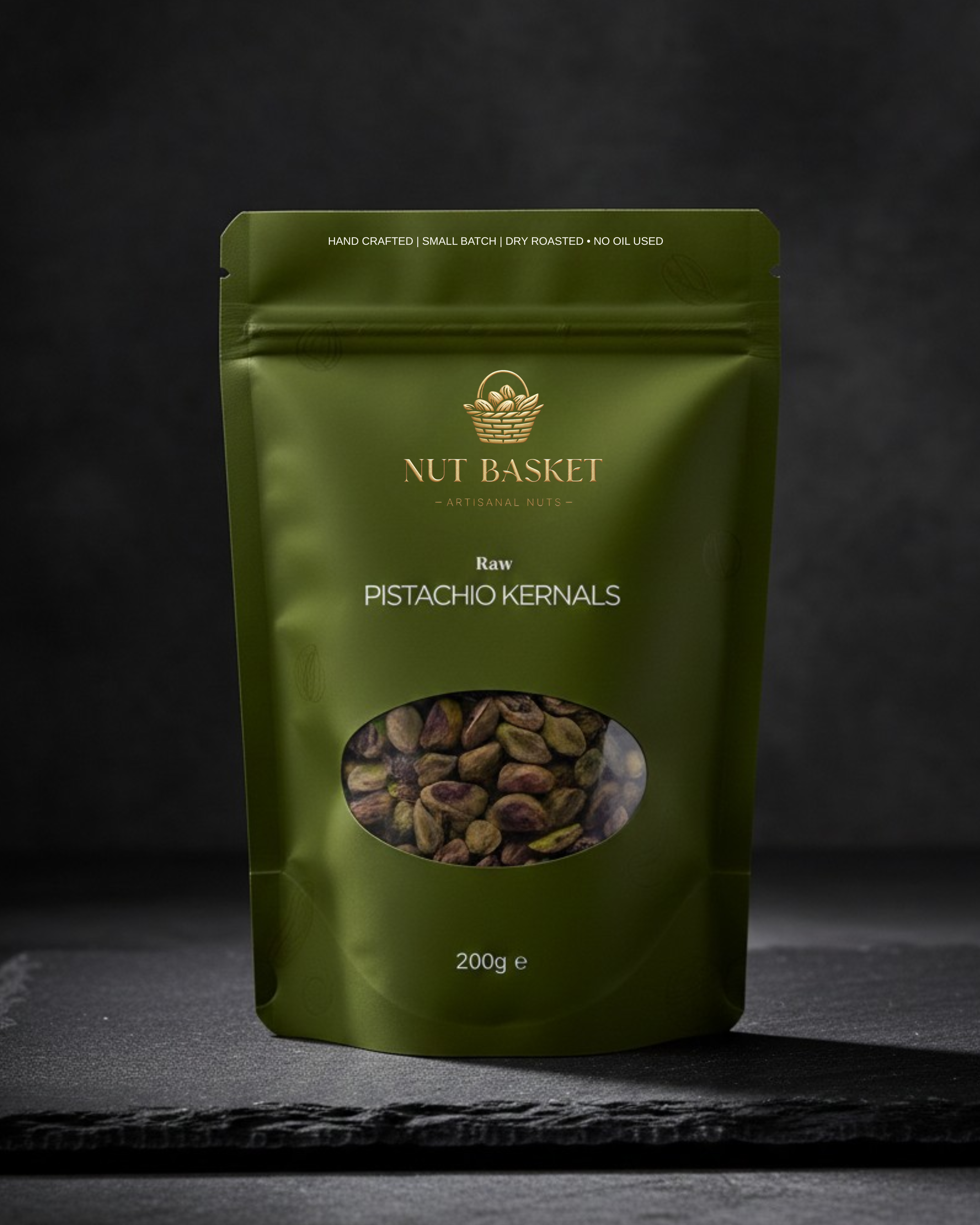 Green package of Nut Basket raw pistachio kernels on a dark background