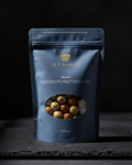 Blue package of Nut Basket Seaweed Peanut Crackers on a dark background