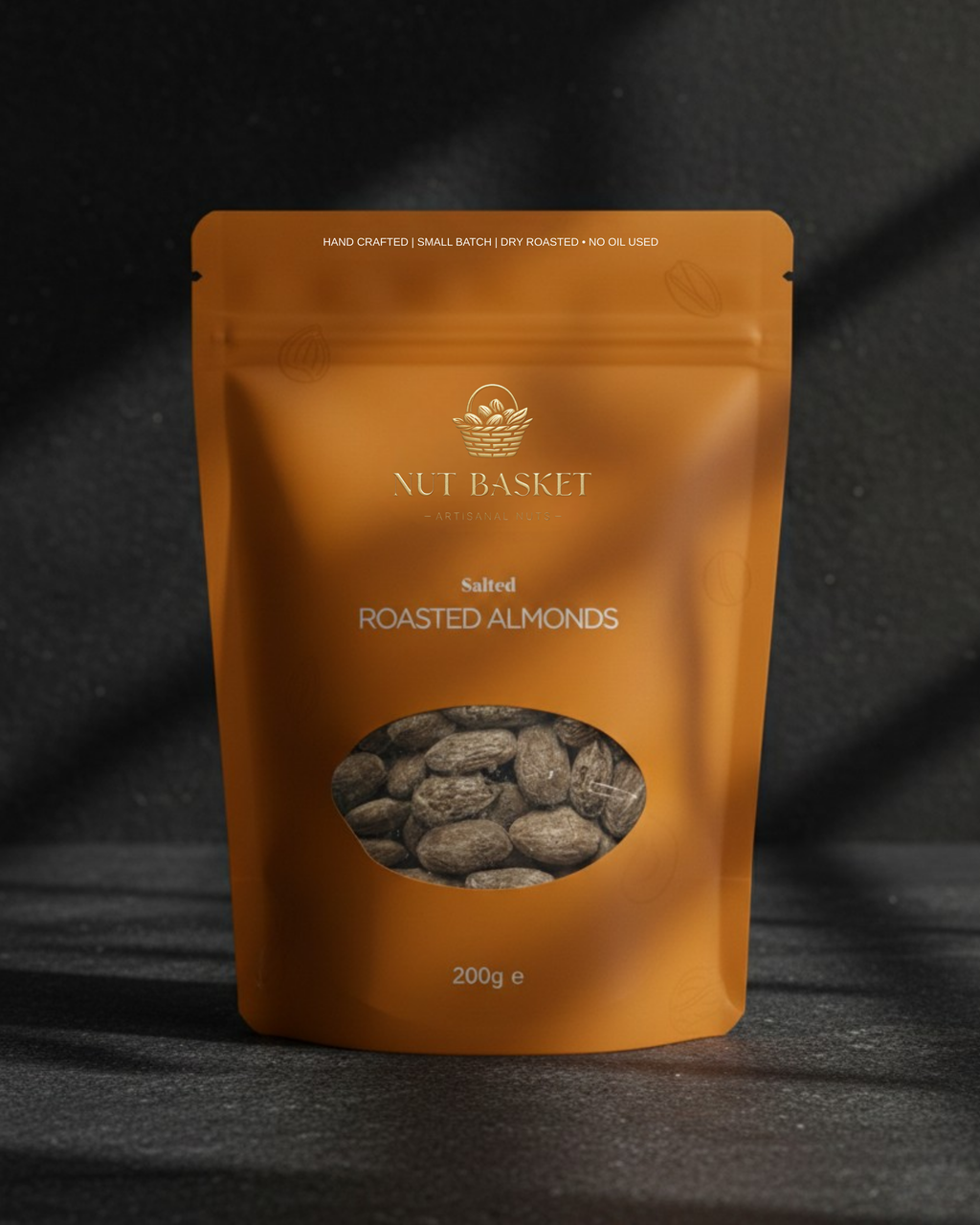 Orange packaging of Nut Basket Salted Roasted Almonds on a dark background