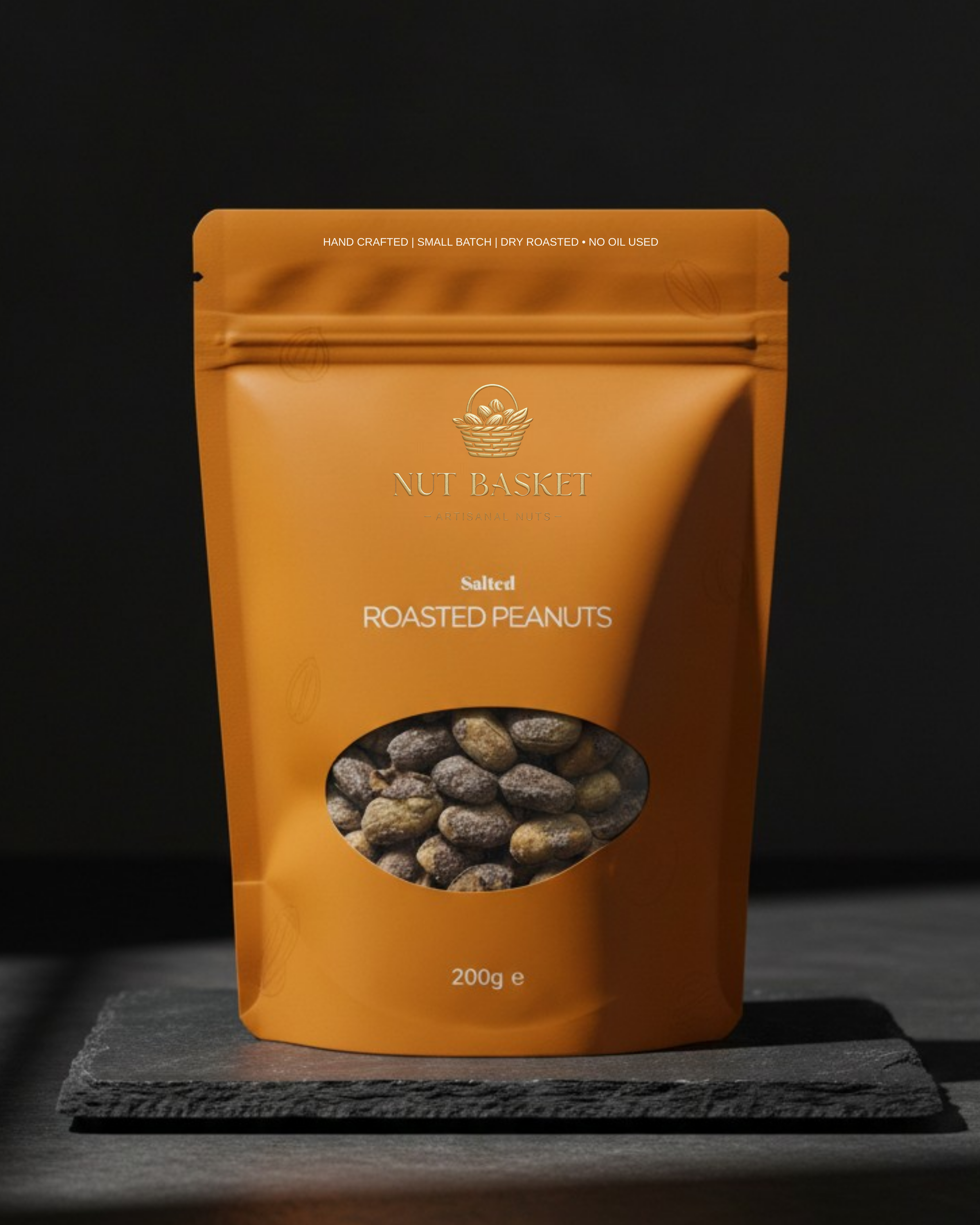 Orange package of Nut Basket roasted peanuts on a dark background