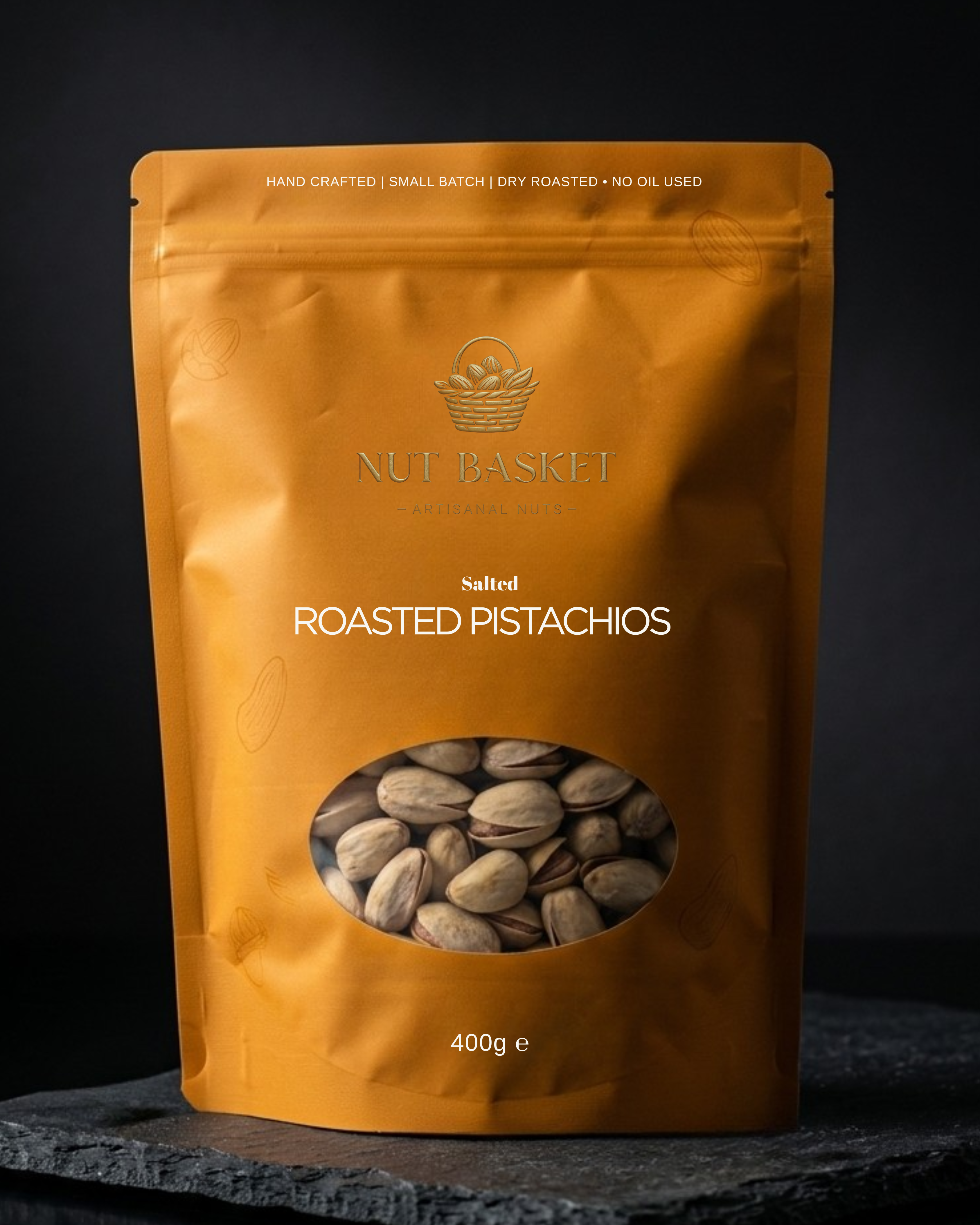 Orange packaging of Nut Basket Roasted Pistachios on a dark background