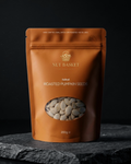 Orange packaging of Nut Basket Roasted Pumpkin Seeds on a dark background